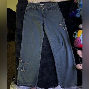 Dark blue baggy jeans with embroidered stars on the sides